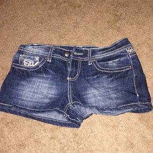 Blue jean shorts with designs on back